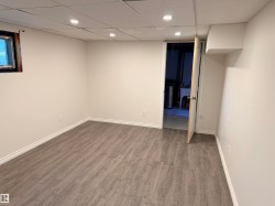 Room featuring wood-finish flooring, recessed lighting, and a drop ceiling - 