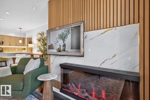Feature wall with vertical wood paneling and a marble-finish accent panel - 207 5025 Edgemont Boulevard, Edmonton, AB 
