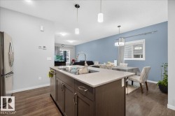 Kitchen island with an undermount sink and gooseneck faucet - 