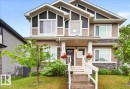 Contemporary two-story exterior featuring a covered porch entrance and a multi-textured facade - 1187 Cy Becker Road, Edmonton, AB 