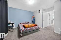 Carpeted room featuring a ceiling-mounted light fixture, painted walls, and white trim - 