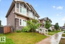 Contemporary two-story residence featuring horizontal siding and stone veneer accents - 1187 Cy Becker Road, Edmonton, AB 