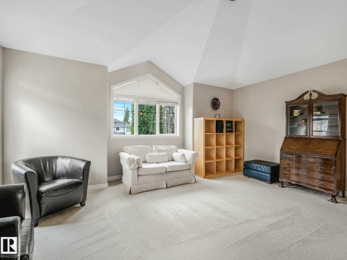 Bright interior space featuring a vaulted ceiling and a large arched window with multiple panes - 1325 Latta Crescent, Edmonton, AB - Indoor