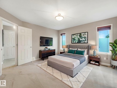 Spacious room featuring neutral carpeting, light neutral wall paint, and multiple windows with wood-finish blinds - 1325 Latta Crescent, Edmonton, AB - Indoor Photo Showing Bedroom