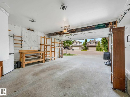 Spacious garage featuring concrete flooring and a white ceiling - 1325 Latta Crescent, Edmonton, AB - Indoor Photo Showing Garage