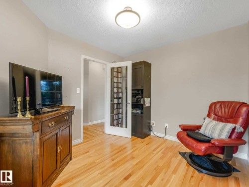 Natural wood-finish flooring complements light-toned walls - 1325 Latta Crescent, Edmonton, AB - Indoor