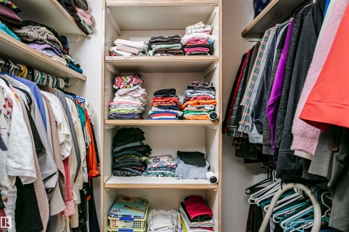 Built-in closet system featuring multiple shelves and hanging rods - 11023 11A Avenue, Edmonton, AB 