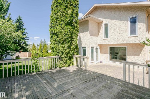 Multi-level wood deck with white railings - 11023 11A Avenue, Edmonton, AB 
