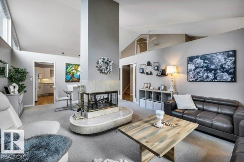 Central fireplace feature with a tiled hearth and a prominent chimney column - 11742 29 Avenue, Edmonton, AB 