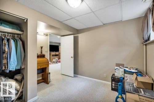 Flexible room with neutral carpet, light-toned walls, and a drop ceiling - 11742 29 Avenue, Edmonton, AB 