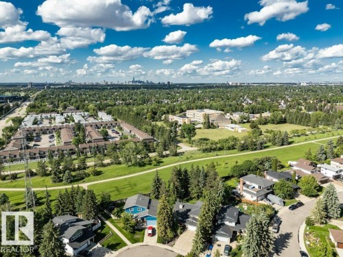 Expansive residential area featuring numerous single-family homes and townhome complexes, surrounded by mature trees and green spaces - 11742 29 Avenue, Edmonton, AB 