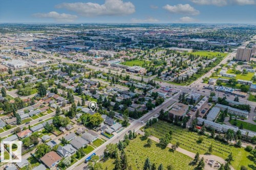 Aerial perspective of a residential neighborhood with a mix of detached homes and multi-story buildings - 10544 53 Avenue, Edmonton, AB 