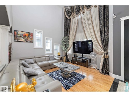 Living area featuring double-height ceilings and hardwood flooring - 9544 154 Street, Edmonton, AB 