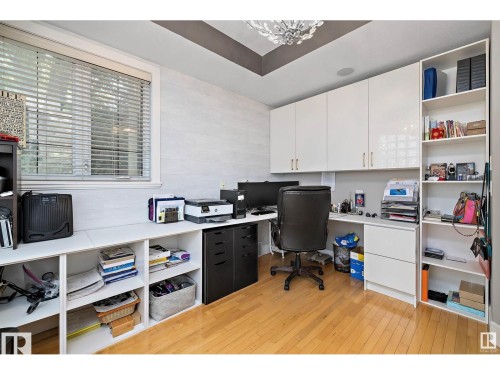Hardwood flooring with extensive built-in cabinetry and shelving - 9544 154 Street, Edmonton, AB 