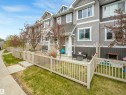 Multi-level townhome exterior featuring gray siding and white trim - 44 1140 Chappelle Boulevard, Edmonton, AB 