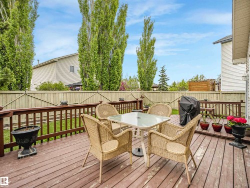 Multi-level wood deck featuring wood railings and a perimeter privacy fence - 13825 128A Avenue, Edmonton, AB - Outdoor With Deck Patio Veranda With Exterior
