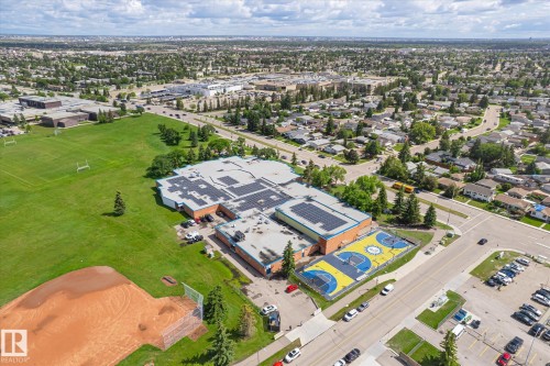Aerial perspective showcasing a sprawling residential area with extensive green spaces - 186 Cornell Crest, Edmonton, AB 
