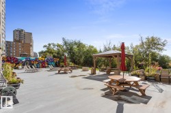 Patio space featuring Gazebo, BBQ Area, Tables, Community Garden & a Colourful Mural - 