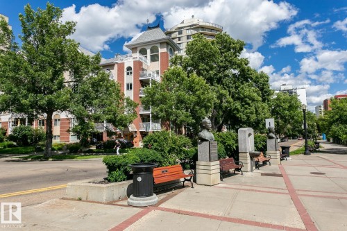 Victoria Promenade - public walkway along the top of the bank.  Benches along the promenade invite you to relax and enjoy the beauty of the seasons. - #602 12303 Jasper Av Nw, Edmonton, AB - Outdoor With Balcony