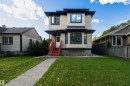 Two-story residential exterior featuring light-colored siding with dark trim accents - 12246 103 Street, Edmonton, AB  - Outdoor 