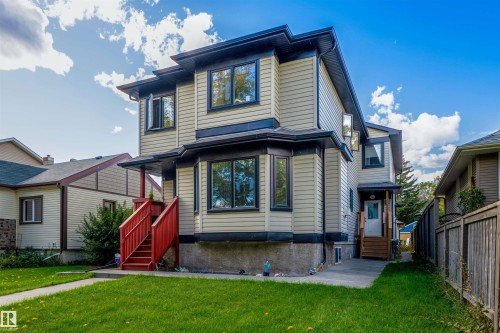 Contemporary two-story residence with light-colored siding and dark trim - 12246 103 Street, Edmonton, AB - Outdoor