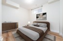Bedroom featuring wood-finish flooring, a contemporary window, and recessed ceiling lighting - 12246 103 Street, Edmonton, AB  - Indoor Photo Showing Bedroom 