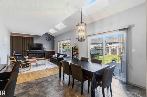 Vaulted ceilings with skylights illuminate this open-concept room - 3061 Spence Wynd, Edmonton, AB 