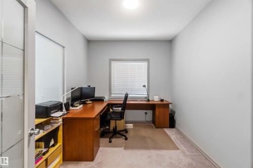 Carpeted room with light grey walls and a single window featuring horizontal blinds - 3061 Spence Wynd, Edmonton, AB 