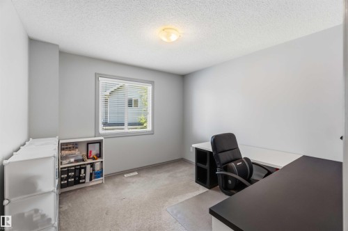 Room with light gray walls, textured ceiling, and gray carpet - 3061 Spence Wynd, Edmonton, AB 