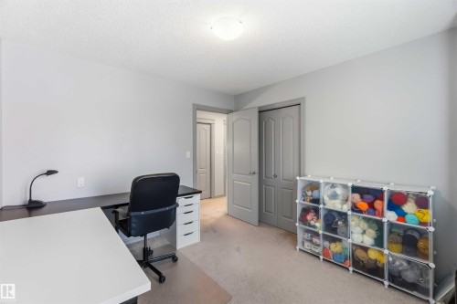 Bright interior room featuring a light gray color palette and carpeting - 3061 Spence Wynd, Edmonton, AB 