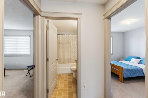 Central hallway featuring three light-colored doorways - 3061 Spence Wynd, Edmonton, AB 