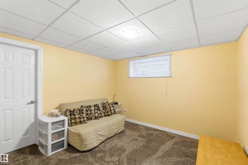 Interior room featuring warm yellow wall paint and a drop ceiling with recessed lighting - 3061 Spence Wynd, Edmonton, AB 