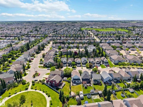 Aerial perspective of a developed residential area featuring numerous single-family homes with pitched roofs - 3061 Spence Wynd, Edmonton, AB 