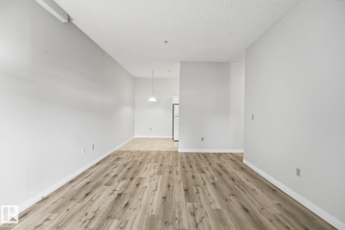 Spacious room with wood-finish flooring - 105 11446 40 Avenue Nw, Edmonton, AB 