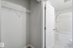White wire shelving in a neutral-toned closet - 