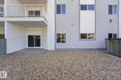 Ground-level patio with sliding glass door access - 