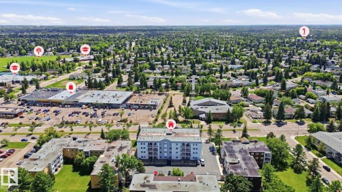 Aerial perspective showcasing the residential community and surrounding commercial establishments - 105 11446 40 Avenue Nw, Edmonton, AB 