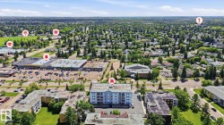 Aerial perspective showcasing the residential community and surrounding commercial establishments - 