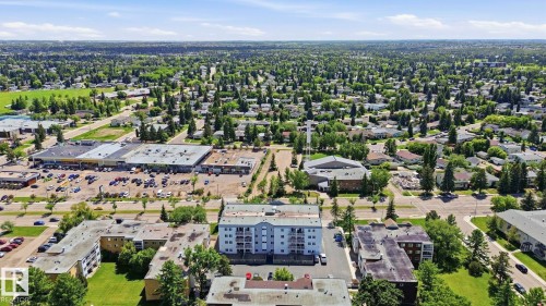Residential apartment building featuring multiple balconies and a light-colored facade - 105 11446 40 Avenue Nw, Edmonton, AB 