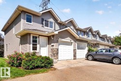 Siding exterior featuring a gabled roofline and stone accents - 
