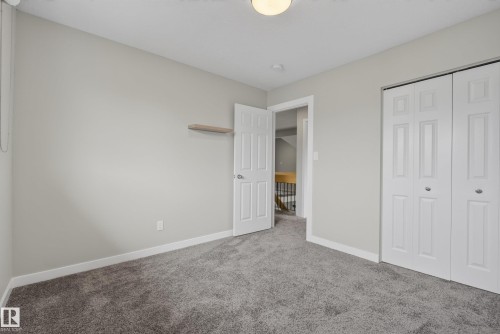 Neutral gray walls complement the plush gray carpeting - 2712 104 Street, Edmonton, AB 