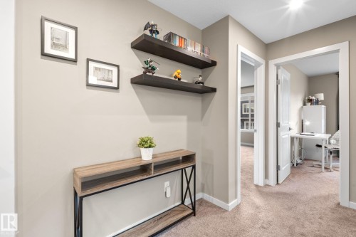 Hallway featuring neutral-toned walls, recessed lighting, and carpet flooring - 2146 Koshal Way, Edmonton, AB 