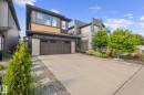 Contemporary exterior featuring multiple architectural styles and a concrete driveway - 2146 Koshal Way, Edmonton, AB 
