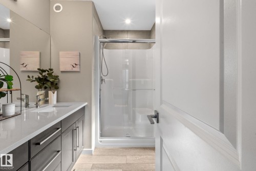 Shower stall featuring a glass enclosure and tiled surround - 2146 Koshal Way, Edmonton, AB 
