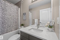 Modern vanity with an integrated sink and light-toned countertop - 