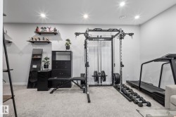 Carpeted room featuring recessed lighting, light gray walls, and dark floating shelves - 