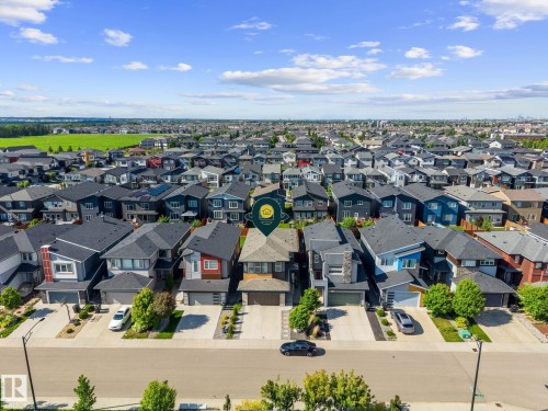 Modern residential community featuring varied architectural styles and mature landscaping - 2146 Koshal Way, Edmonton, AB 