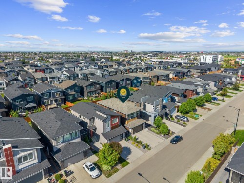 Contemporary residential property featuring a multi-story exterior with a two-car garage and a paved driveway - 2146 Koshal Way, Edmonton, AB 