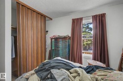 Wood-finish bifold closet doors with a coordinating wood header - 
