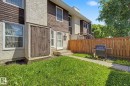 Exterior facade featuring stucco and horizontal wood siding - 18409 66 Avenue, Edmonton, AB 